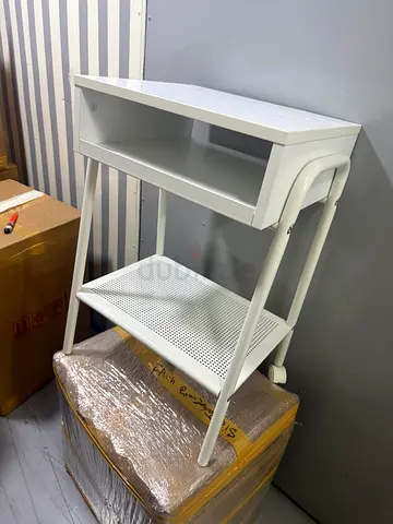 White metal side table with shelf and perforated lower tray