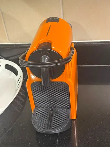 Nespresso capsule coffee machine - compact orange unit