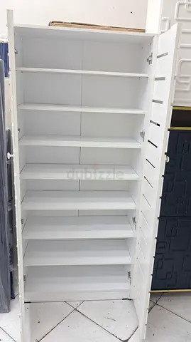 White Tall Storage Cabinet with Multiple Shelves - Good Condition