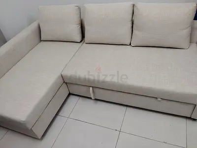 Light beige L-shaped fabric sofa with storage, good condition