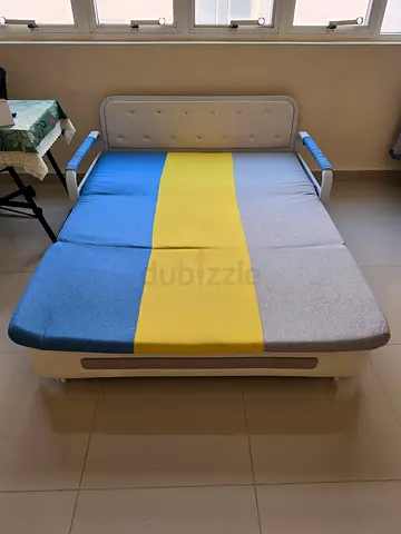 Convertible single sofa bed with colorful fabric cover (blue/yellow/gray)