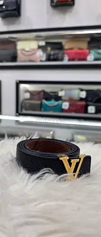 Black designer-style leather belt with gold LV buckle - good condition