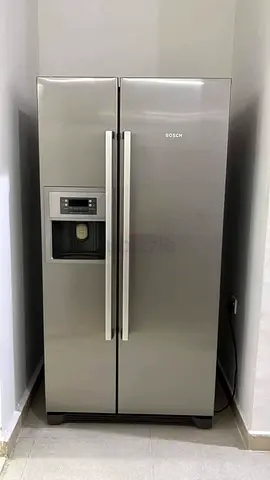 Bosch side by side fridge and freezer new model slightly used with ice maker water dispenser