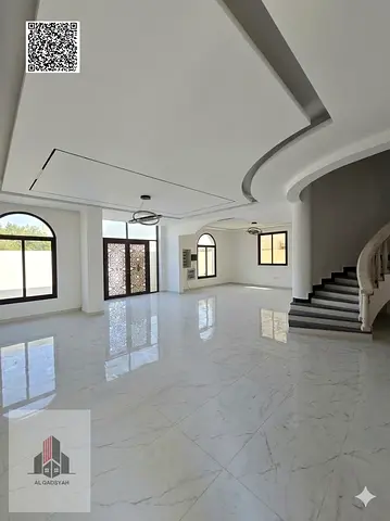 Villa for sale with a stone façade, situated on two streets and a walkway, opposite Al Rahmaniya, Sharjah.
