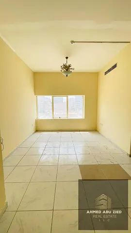 Annual 2BHK apartment for rent in Ajman Corniche, 2 bathrooms, master rooms, central AC, second row from Corniche, AED 27,000 yearly.