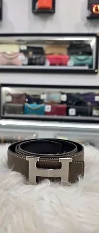 Men's brown leather belt with metal H buckle - good condition