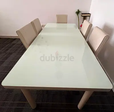 6-seater glass top dining table with upholstered chairs - good condition