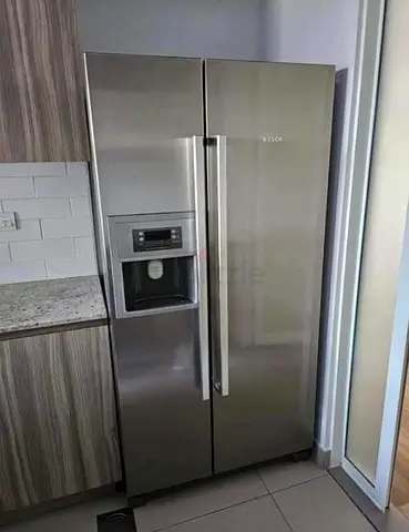 Bosch side by side fridge and freezer new model slightly used with ice maker water dispenser