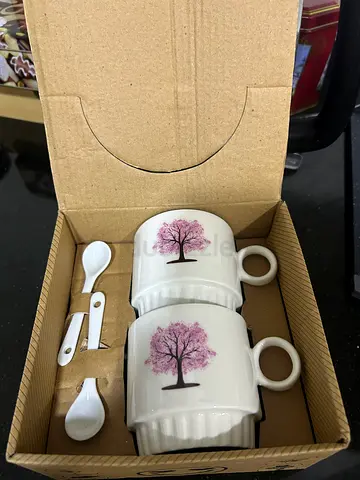 Set of 2 white ceramic cups with matching spoons - never used, good as a gift