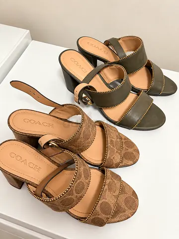 Pair of Coach women's heeled mules — brown canvas and olive leather, size not specified