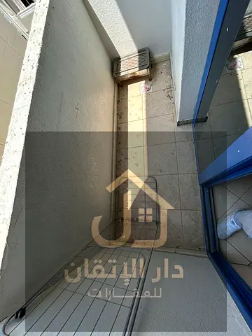A golden opportunity for rent: studio apartment in Al Majra area with balcony, prime location Central AC
