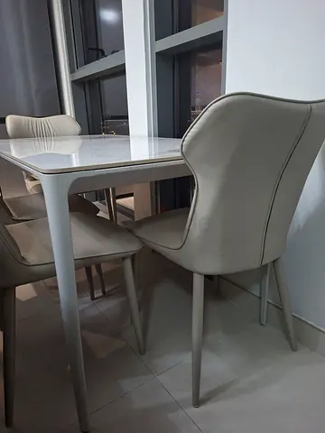 Dining set of 4 modern beige chairs and marble table - good condition