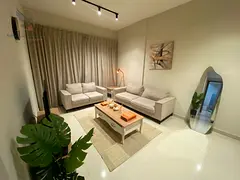 Fully furnished apartment with two bedrooms, a living room, and a balcony; fully equipped with all h