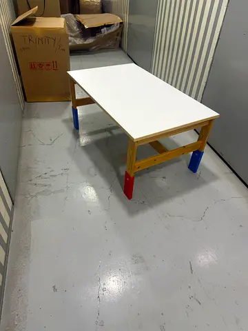 Kids small activity table with white top and colorful legs