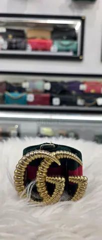 Small green and red striped belt with gold buckle (used)