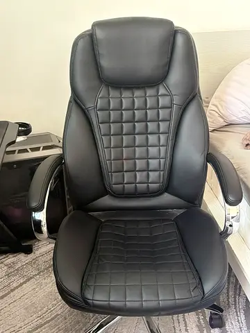Black ergonomic executive office chair with quilted faux leather