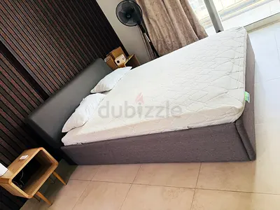 Queen fabric bed frame with mattress and pillows  - good condition