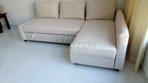 Beige L-shaped Sofa Bed with Storage - Good Condition