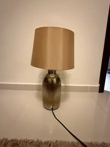 Bronze textured table lamp with beige fabric shade 30aed per lamp