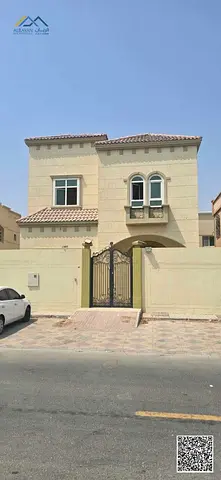 An exceptional residential rental opportunity in Al Rawda 3. A high-end, two-story villa for rent, situated in a vibrant area with charming natural su