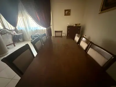 Solid wood 8-seater dining table with chairs - good condition