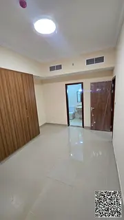 Brand-new two-bedroom apartment with a living room, a very spacious area, and an open view in Al Jur