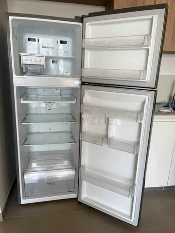 Used double-door refrigerator with top freezer - good condition