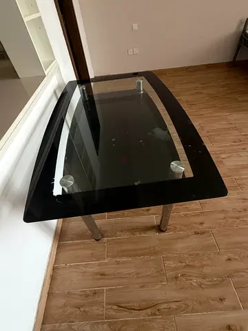 Black glass coffee table with metal legs - good condition