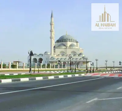 Residential plot for sale in Al Raqibah, Sharjah—a prime location situated on a corner (dual-street access).