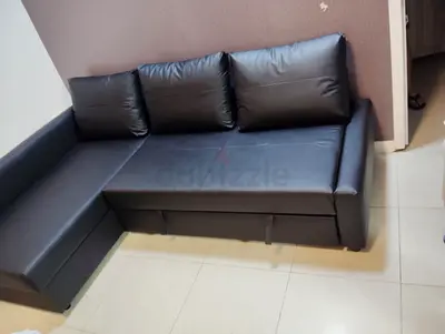 3-seater L-shaped black faux leather sofa with storage