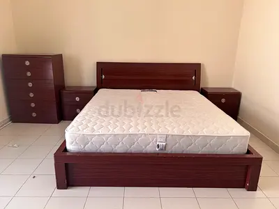 Hydraulic King bed with mattress and matching drawer set - dark wood