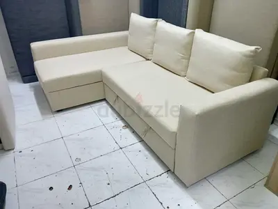 L-shaped beige fabric sofa with storage - good condition