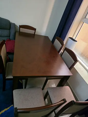 Solid Wood Dining Table with 6 Chairs - Good Condition brought for 1047 AED.