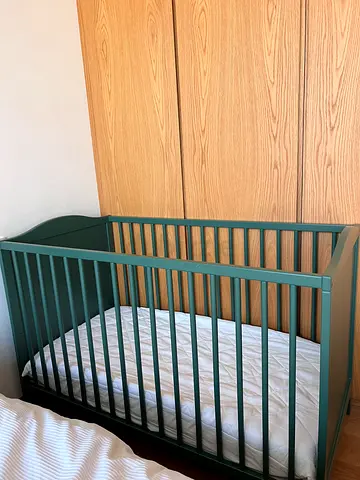Green wooden baby crib in perfect condition (two brand new mattresses included with one memory foam)
