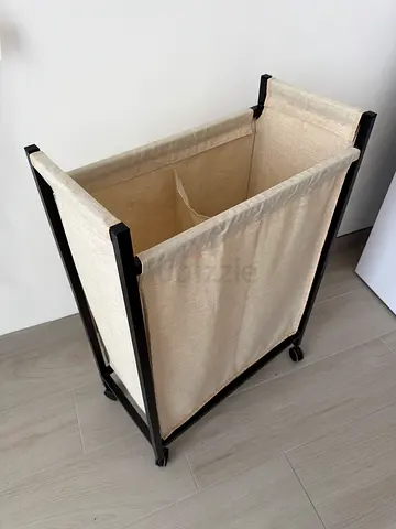 IKEA Laundry Basket with rolling frame four wheels, in condition like new. holds 9-10kg of laundry.