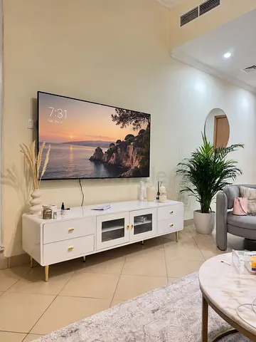 White TV Console Cabinet with Gold Accents - Excellent Condition