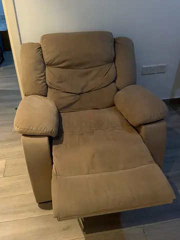 Beige recliner armchair in good used condition