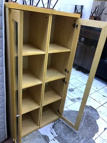 Light wood display cabinet with glass door - 8 shelf storage
