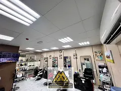 A fully equipped salon ready for immediate operation, situated in a prime, high-traffic location nex