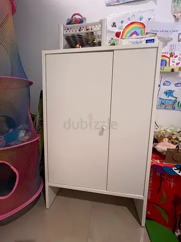 White compact storage cabinet with single door - good condition