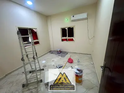 Studio in Al Rashidiya 3 near Grand Mall, separate room and kitchen, split AC. AED 18,005/year, 4/6 payments.
