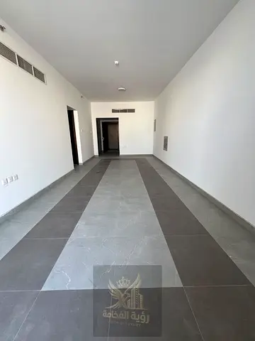 Brand new two bedroom apartment for annual rent in New Muwaileh One master bedroom 3 bathrooms Balcony Prime location on a main road Payment in 4 or 6