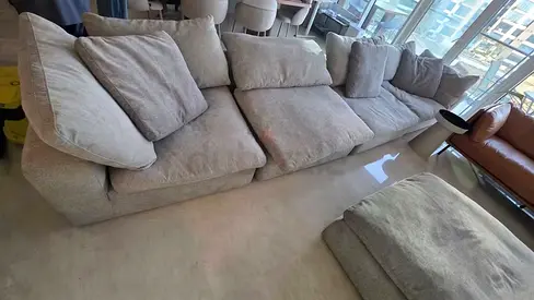 Perfect condition Pan Emirates Pianca Corner feather filled sofa with footstool