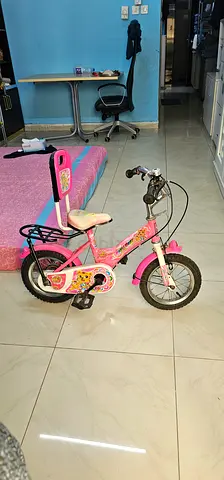 Little girl's pink kids bicycle with training wheels AED60 Good Condition