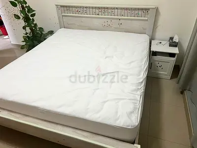 Queen size wooden bed frame with mattress and bedside table - light finish