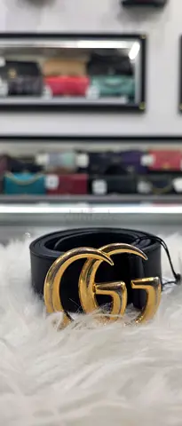 Black leather belt with gold double-G style buckle - gently used