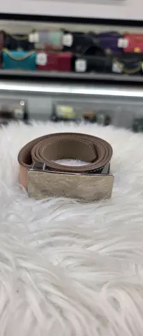 Gently used beige leather belt with silver buckle