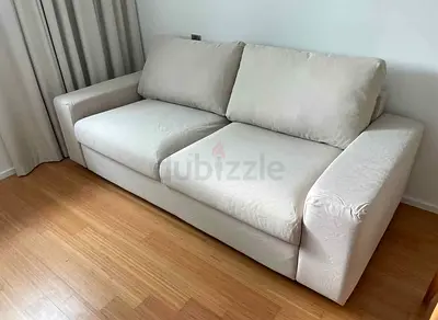 beige 2-seater fabric sofa bed in good condition