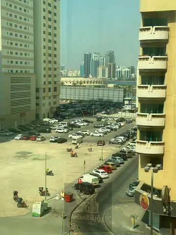For annual rent in Sharjah Al Khan on the main road near Afamia one bedroom and living room central AC built in wardrobes AED 28000 4 cheques deposit