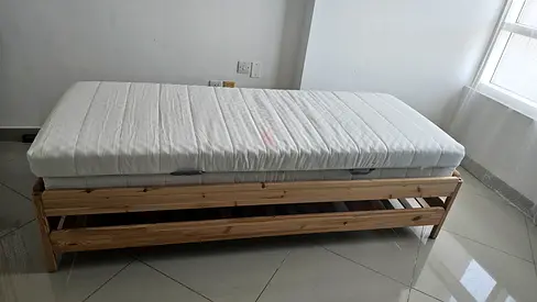 wood bed frame with mattress - good condition. Can be used either single or large bed